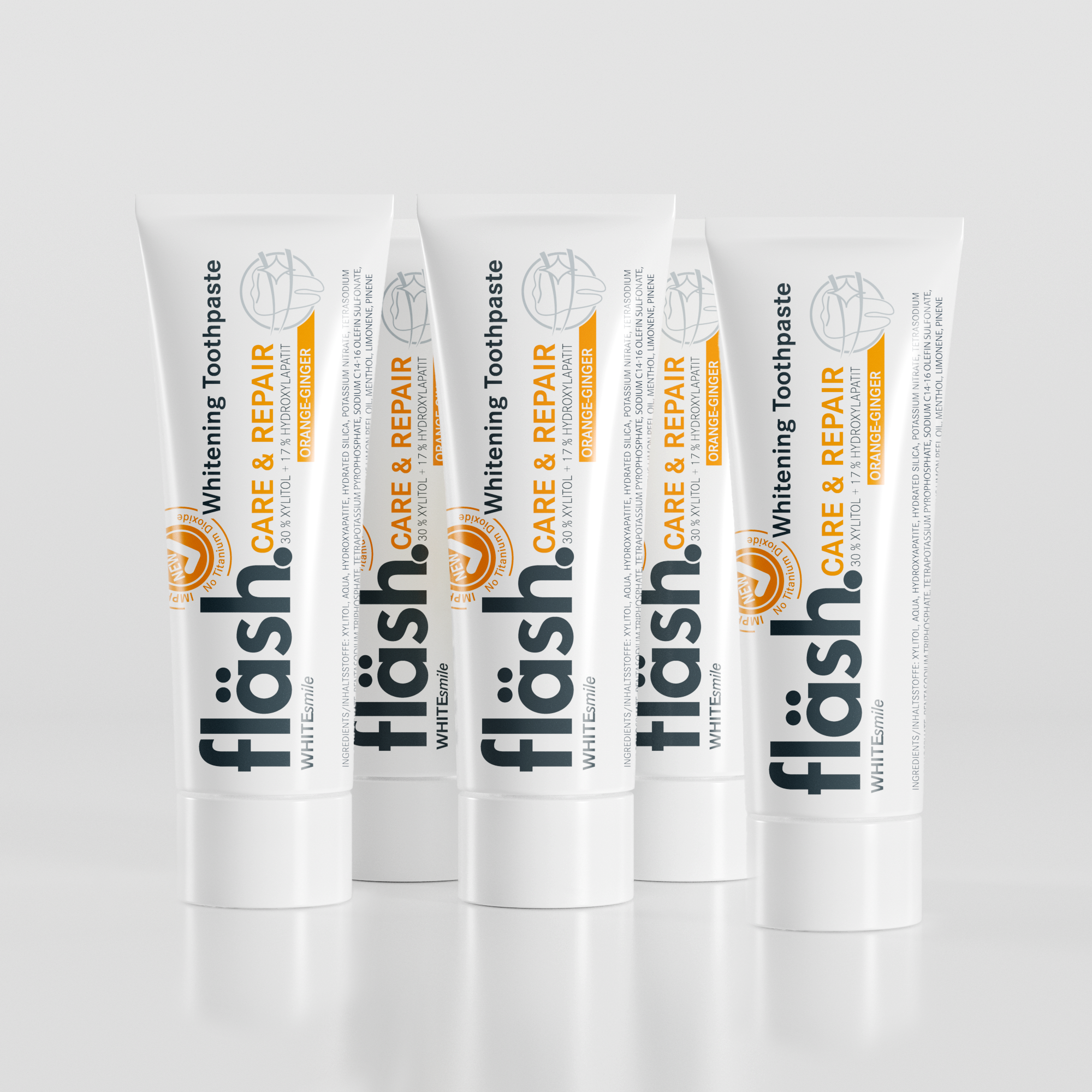 Fünf Tuben fläsh Zahnpasta der Sorte Orange-Ingwer auf hellgrauem Hintergrund. Auf den Tuben steht neben dem schwarzen Fläsh Logo die Beschreibung: "fläsh care and Repair Whitening Toothpaste"