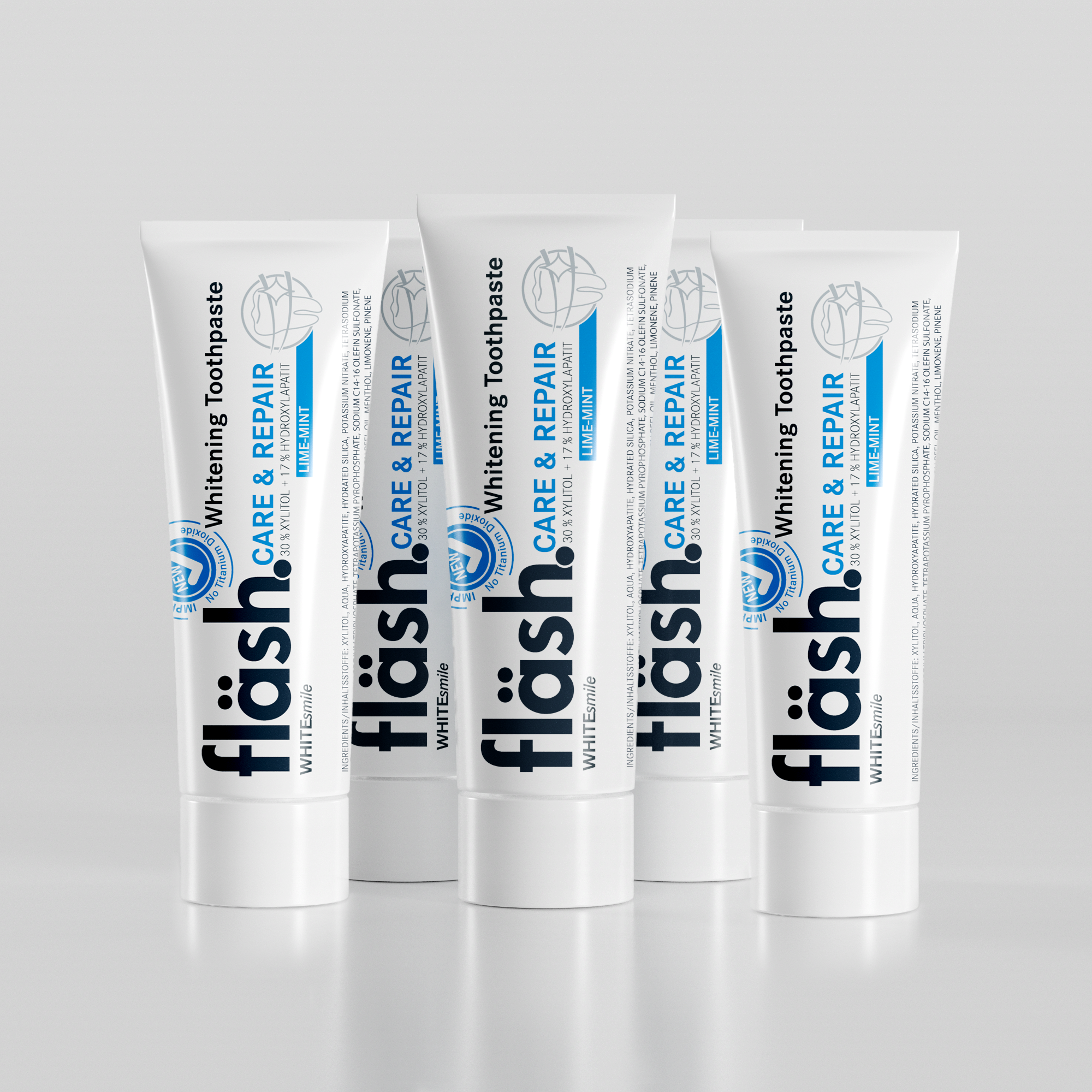 Fünf Tuben fläsh Zahnpasta auf hellgrauem Hintergrund. Auf den Tuben steht neben dem schwarzen Fläsh Logo die Beschreibung: "fläsh care and Repair Whitening Toothpaste"