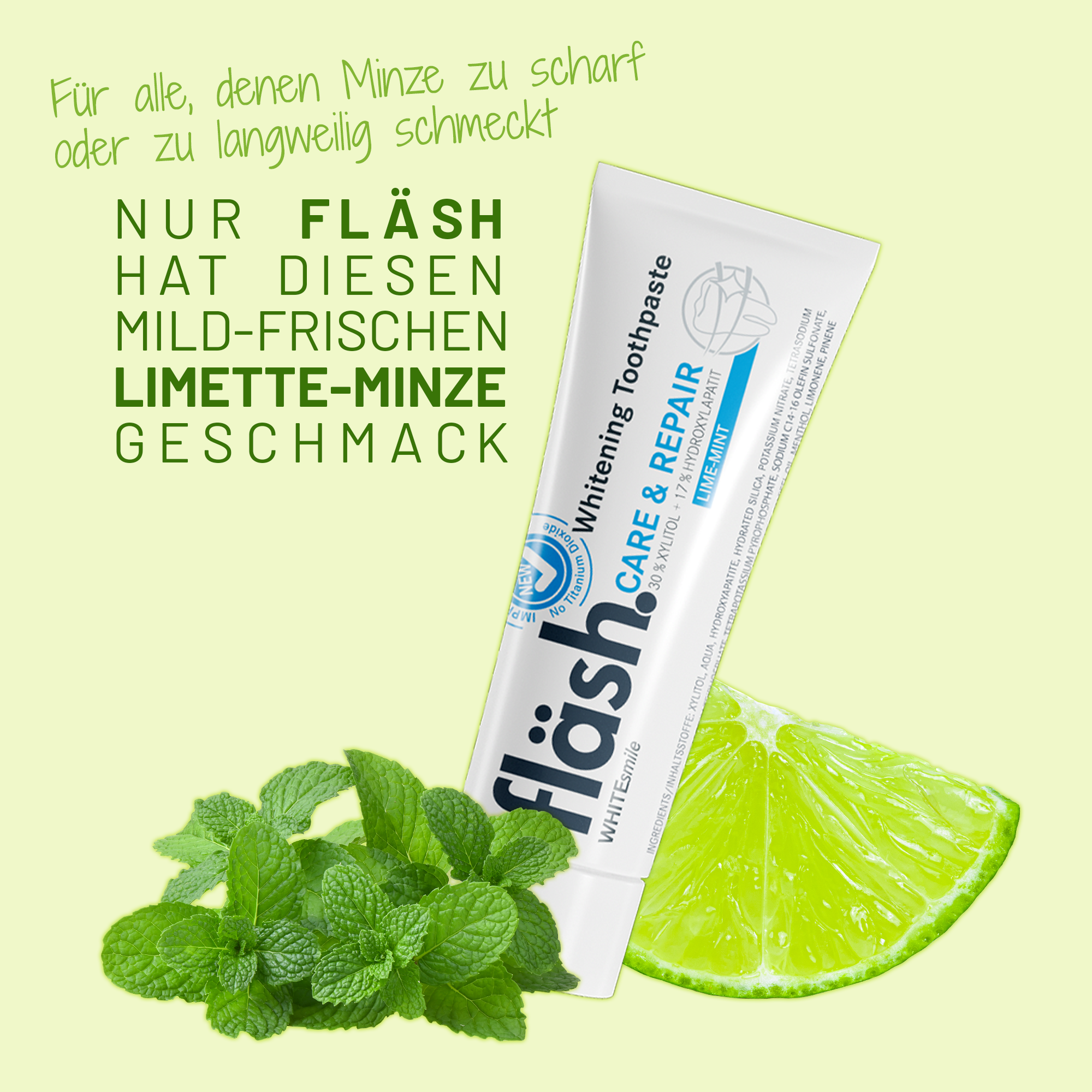 Eine Tube fläsh Zahnpasta Limette-Minze auf hellgelbem Hintergrund, mit einer Limettenspalte und grünen Minzblättchen garniert.