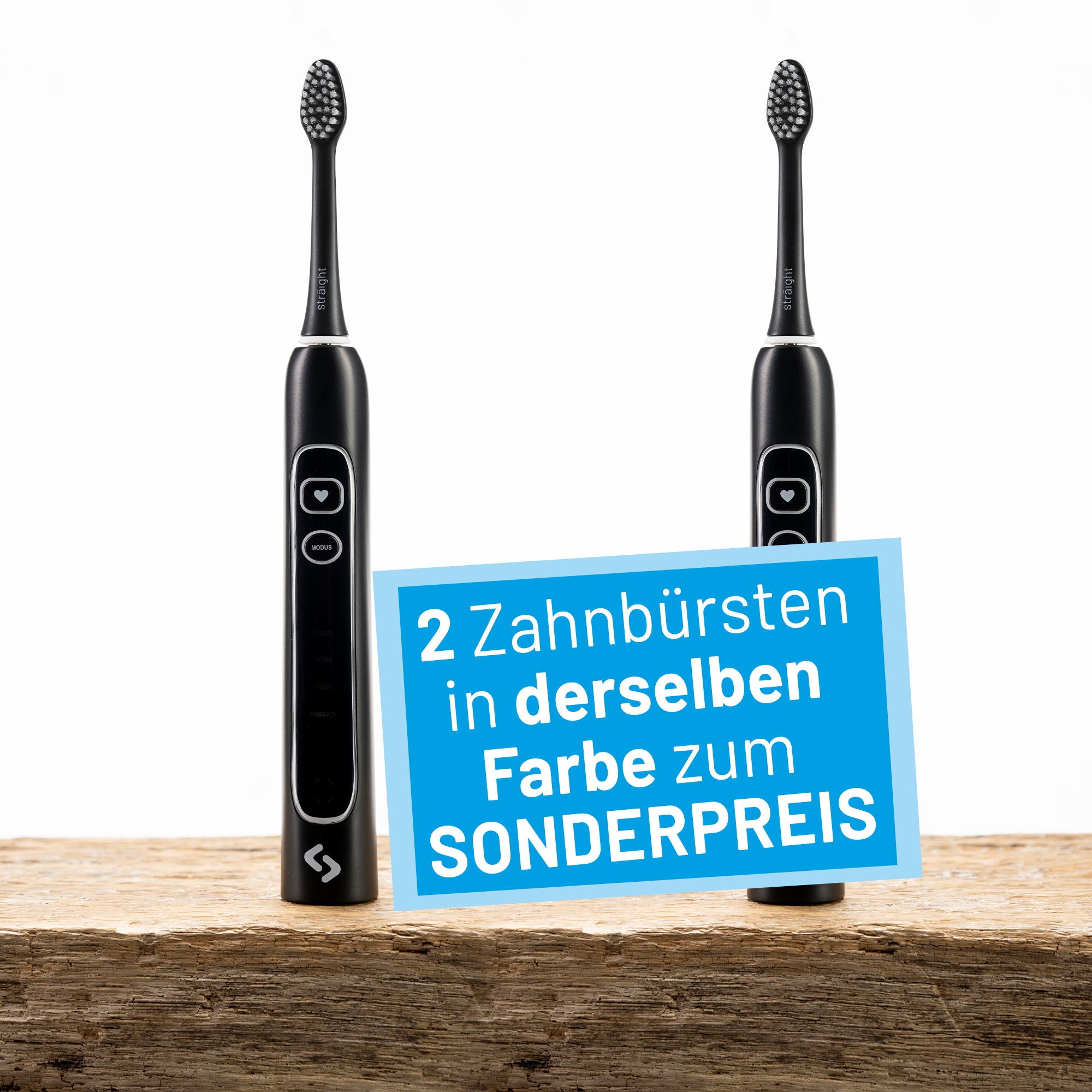Zwei schwarze sträight Schallzahnbürsten stehen auf einer Holzplatte.