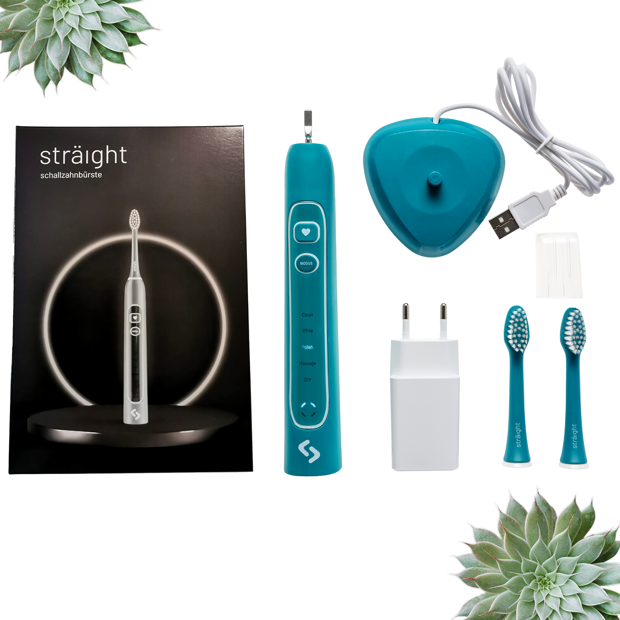 Auf weissem Hintergrund liegen alle im Lieferumfang enthaltenen Elemente der sträight Schallzahnbürste, Modell "Grün Light": der schwarze Produktkarton, 2 Bürstenköpfe, der Zahnbürstengriff, die Ladestation mit Stecker.