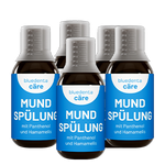 Fünf Flaschen bluedenta cäre Mundspülung auf transparentem Hintergrund.  