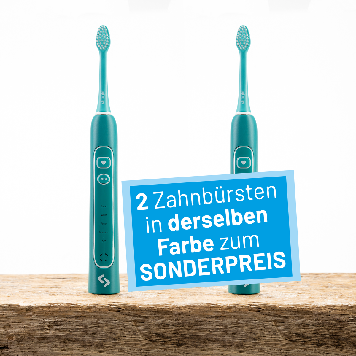 Zwei grüne sträight Schallzahnbürsten stehen auf einer Holzplatte.
